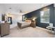 Well-lit main bedroom with accent wall, carpeted floors, and contemporary furnishings at 3991 Mellon Dr, Odessa, FL 33556