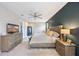 Bright bedroom with plush carpet, a stylish accent wall and comfortable contemporary furnishings at 3991 Mellon Dr, Odessa, FL 33556