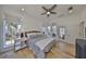 Bright bedroom with wood floors, large windows, and stylish furnishings at 413 Islebay Dr, Apollo Beach, FL 33572