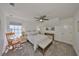 Cozy bedroom with ceiling fan, rocking chair, and soft lighting at 413 Islebay Dr, Apollo Beach, FL 33572