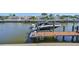 View of the boat dock with lift, providing direct access to the serene waterfront at 413 Islebay Dr, Apollo Beach, FL 33572