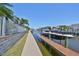 Waterfront home featuring a boat dock with lift and canal access at 413 Islebay Dr, Apollo Beach, FL 33572