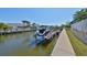 Waterfront property featuring a private boat dock, lift, and stunning water views at 413 Islebay Dr, Apollo Beach, FL 33572