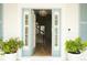 Inviting entryway featuring a stylish light blue front door with glass inserts and sidelights at 413 Islebay Dr, Apollo Beach, FL 33572