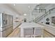 Bright kitchen featuring a large island, modern appliances, and a clear view of the open-concept living area at 413 Islebay Dr, Apollo Beach, FL 33572