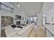 Spacious living room with a fireplace and multiple windows offering abundant natural light throughout the home at 413 Islebay Dr, Apollo Beach, FL 33572