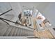 Aerial view showcasing open-concept floor plan with kitchen, living room, and staircase at 413 Islebay Dr, Apollo Beach, FL 33572
