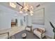 Bright living room featuring stylish furniture, modern lighting, and views into other rooms at 413 Islebay Dr, Apollo Beach, FL 33572