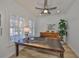 Comfortable office space featuring shuttered windows and a ceiling fan at 413 Islebay Dr, Apollo Beach, FL 33572