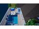 Aerial view of the backyard pool area with lounge chairs, patio, and waterfront access at 413 Islebay Dr, Apollo Beach, FL 33572