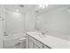Bright bathroom featuring subway tile, and a modern vanity with stone countertop at 4255 Big Sky Dr, Spring Hill, FL 34604