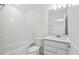 Bathroom with subway tile, and a modern vanity with stone countertop at 4255 Big Sky Dr, Spring Hill, FL 34604