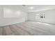 Upstairs bonus room with large window, neutral carpet, and abundant natural light at 4255 Big Sky Dr, Spring Hill, FL 34604
