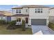 Charming two-story home with a well-maintained lawn, a two-car garage, and inviting curb appeal at 4255 Big Sky Dr, Spring Hill, FL 34604