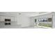 Open floor plan featuring a modern kitchen, living room, and sliding glass doors to a beautifully fenced yard at 4255 Big Sky Dr, Spring Hill, FL 34604