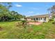 Well-maintained backyard with patio, landscaping, and a view of the home's sunroom at 4322 22Nd N Ave, St Petersburg, FL 33713