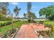 Lush backyard with a patio overlooking a tranquil lake view at 4322 22Nd N Ave, St Petersburg, FL 33713