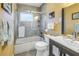 Bathroom featuring an updated vanity, a shower with glass door and decorative accents at 4322 22Nd N Ave, St Petersburg, FL 33713
