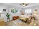 Bedroom features a ceiling fan, window, rug, plants, and comfy looking bed at 4322 22Nd N Ave, St Petersburg, FL 33713