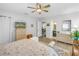 Bedroom featuring wicker furnishings, ceiling fan, and views to the bathroom at 4322 22Nd N Ave, St Petersburg, FL 33713