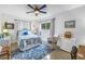 Bedroom with a bed that has blue starfish covers, ceiling fan and a window with curtains at 4322 22Nd N Ave, St Petersburg, FL 33713
