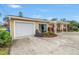 Charming single-story home featuring a well-maintained lawn, attached garage, and cozy front porch at 4322 22Nd N Ave, St Petersburg, FL 33713