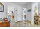 Hallway with terrazzo floors, white walls, and multiple doorways leading to other rooms of the house at 4322 22Nd N Ave, St Petersburg, FL 33713