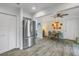 Modern kitchen with stainless steel appliances, grey cabinets, and an adjacent dining area at 4322 22Nd N Ave, St Petersburg, FL 33713