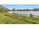 Tranquil lake view surrounded by lush vegetation and distant residences, showcasing the community's natural beauty at 4322 22Nd N Ave, St Petersburg, FL 33713