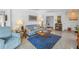 Comfortable living room with a plush sofa, unique rug, and bright, neutral decor at 4322 22Nd N Ave, St Petersburg, FL 33713