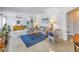 Bright living room with a geometric rug, ceiling fan, and ample natural light at 4322 22Nd N Ave, St Petersburg, FL 33713