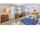 Cozy living room featuring a large window, stylish furniture, and polished terrazzo floors at 4322 22Nd N Ave, St Petersburg, FL 33713
