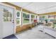 Bright sunroom with comfortable seating and serene outdoor views at 4322 22Nd N Ave, St Petersburg, FL 33713