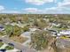 Aerial view of a residential neighborhood showcasing the home's location and surrounding greenery at 4514 S Shamrock Rd, Tampa, FL 33611