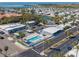 Aerial view of the community featuring a swimming pool, clubhouse, and waterfront access at 4851 W Gandy Blvd # B7L9, Tampa, FL 33611