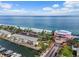 Scenic aerial shot of beachfront condominiums with boat docks, showcasing the waterfront lifestyle at 4966 Coquina Key Se Dr # 4966, St Petersburg, FL 33705