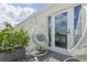 Relaxing balcony with stylish egg chairs, lush greenery, and sunny views, perfect for outdoor lounging at 4966 Coquina Key Se Dr # 4966, St Petersburg, FL 33705