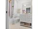 Stylish bathroom with a tub-shower, a patterned tile floor, and a modern vanity with storage at 4966 Coquina Key Se Dr # 4966, St Petersburg, FL 33705