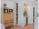 Butler's pantry with custom cabinets, a wine fridge, and marble countertops at 4966 Coquina Key Se Dr # 4966, St Petersburg, FL 33705