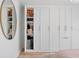 Spacious closet with custom shelving, ample storage for shoes, hats, and clothes, with stylish lighting at 4966 Coquina Key Se Dr # 4966, St Petersburg, FL 33705