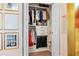Organized closet with hanging clothes, drawers, and storage bins, offering efficient and stylish storage solutions at 4966 Coquina Key Se Dr # 4966, St Petersburg, FL 33705