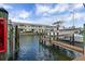 Boat docked near waterfront condos, set against a backdrop of clear waters and sunny skies at 4966 Coquina Key Se Dr # 4966, St Petersburg, FL 33705