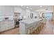 Bright, spacious kitchen featuring white cabinets, marble countertops, and stainless steel appliances at 4966 Coquina Key Se Dr # 4966, St Petersburg, FL 33705