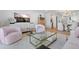 Bright living room area with light wood floors, stylish furniture, and an open floor plan at 4966 Coquina Key Se Dr # 4966, St Petersburg, FL 33705