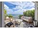 The patio features comfortable outdoor seating, landscaping, and captivating ocean views at 4966 Coquina Key Se Dr # 4966, St Petersburg, FL 33705