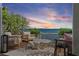 Seating area on patio with stunning sunset views over the Gulf of Mexico at 4966 Coquina Key Se Dr # 4966, St Petersburg, FL 33705