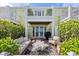 The backyard area offers ample seating, lush landscaping, and stunning views of the Gulf at 4966 Coquina Key Se Dr # 4966, St Petersburg, FL 33705