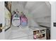 Hall closet under the stairs offers storage for sporting equipment, shoes, and other accessories at 4966 Coquina Key Se Dr # 4966, St Petersburg, FL 33705