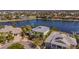 Aerial view showcases waterfront homes with lush landscaping and private docks at 5321 Fishersound Ln, Apollo Beach, FL 33572