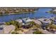 Stunning aerial view of a waterfront home with lush landscaping and private dock at 5321 Fishersound Ln, Apollo Beach, FL 33572